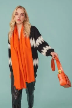 JAYLEY Cashmere Blend Wrap In Orange With Fringed Hem And Logo